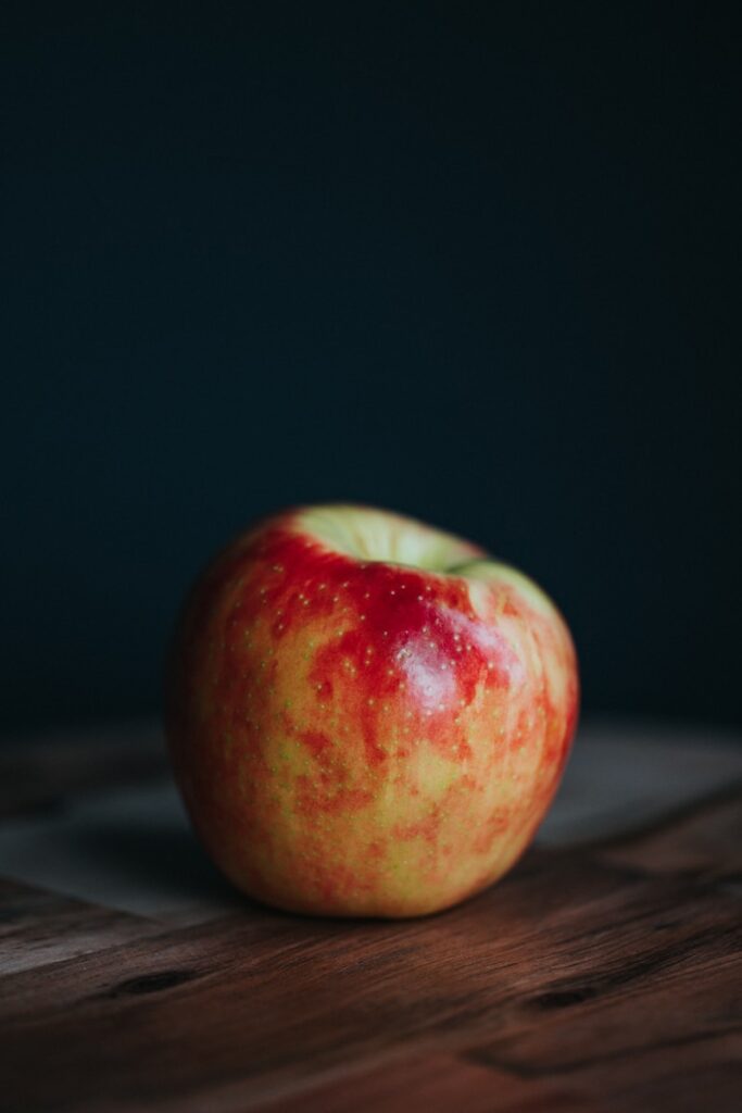 red apple fruit on black surface